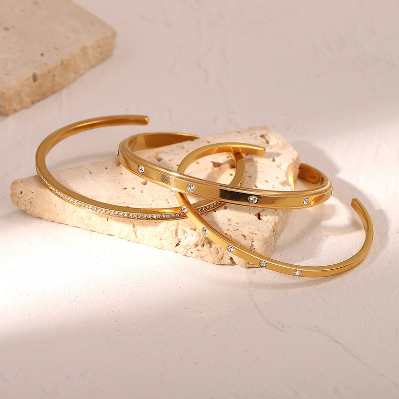 Pulsera abierta de acero inoxidable con circonitas redondas y diamantes de moda