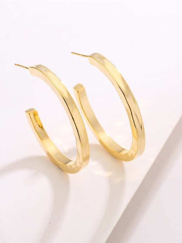 Arete minimalista geométrico de oro laminado