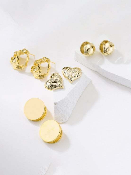 Arete minimalista geométrico de oro laminado