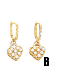 Arete Huggie vintage con corazón de concha de oro laminado