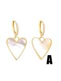 Arete Huggie vintage con corazón de concha de oro laminado