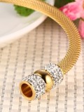 Exquisito brazalete de titanio con brillantes diamantes de imitación chapados en oro