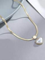 Collar de cadena de hueso de serpiente minimalista con corazón de acero de titanio