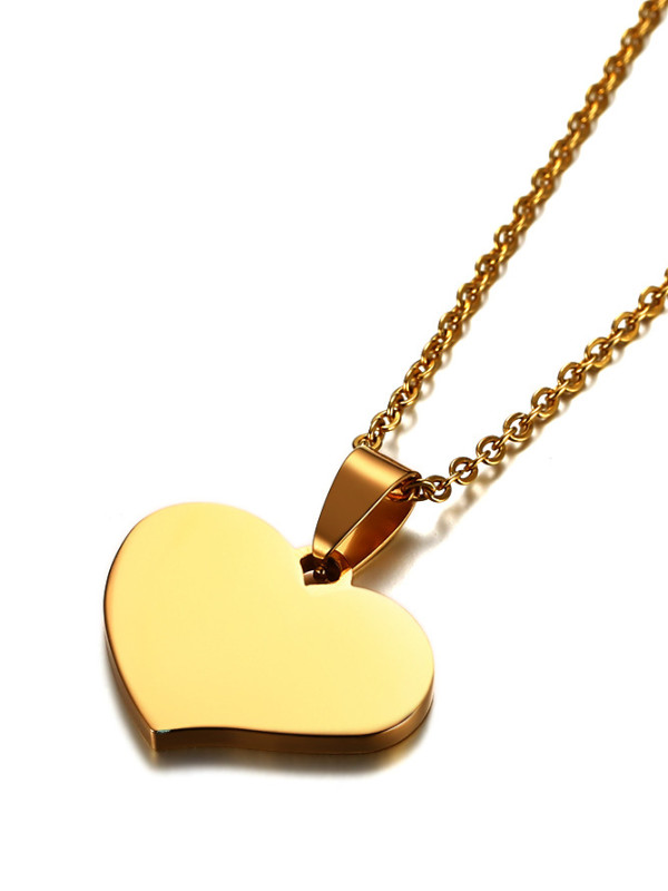 Elegante colgante de titanio en forma de corazón chapado en oro