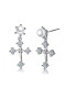 Elegantes aretes colgantes de concha en forma de cruz chapados en platino