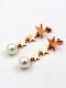 Aretes colgantes delicados con estrella de titanio