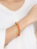 Pulsera de titanio con piedra naranja en forma de delfín de moda