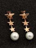 Aretes colgantes delicados con estrella de titanio