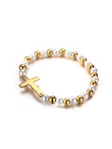 Elegante pulsera de titanio en forma de cruz chapada en oro