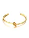Brazalete de titanio en forma de nudo chapado en oro de diseño abierto