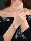 Brazalete de titanio esmerilado chapado en oro rosa de moda