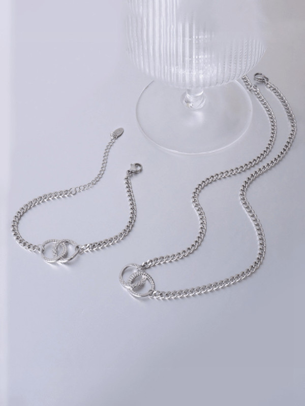 Conjunto de collar y brazalete geométrico minimalista de acero titanio