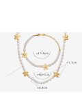 Conjunto de pulsera y collar de flores minimalistas de perlas de agua dulce de acero titanio