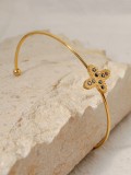 Brazalete minimalista con cruz de circonita cúbica y acero de titanio