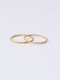 Titanio con anillos de banda redondos torcidos simplistas chapados en oro