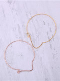 Titanio con brazaletes redondos simplistas chapados en oro