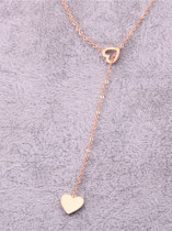 Titanio con collar de medallón hueco de corazón simplista chapado en oro