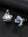 Aretes de perlas negras con flor de circón 3A de plata esterlina