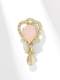 Broche de latón con corona de circonitas cúbicas.