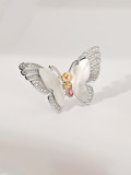 Broche de mariposa de concha de latón