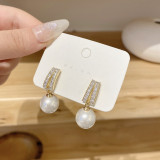Pendientes de circón con perlas artificiales con incrustaciones de cobre y nudo de lazo en forma de corazón a la moda, 1 par
