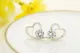 1 par de pendientes elegantes con incrustaciones de cobre y circonita en forma de corazón
