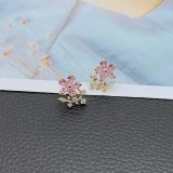 1 par de pendientes elegantes con incrustaciones de flores y diamantes de imitación de cobre