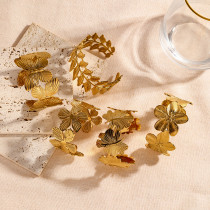 Brazalete asimétrico de acero inoxidable con mariposa, flor y hojas de estilo vintage