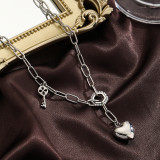 Collar con colgante chapado en plata con revestimiento de cobre en forma de corazón estilo IG