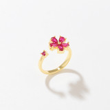 Anillo abierto con circonitas de cobre y flor dulce