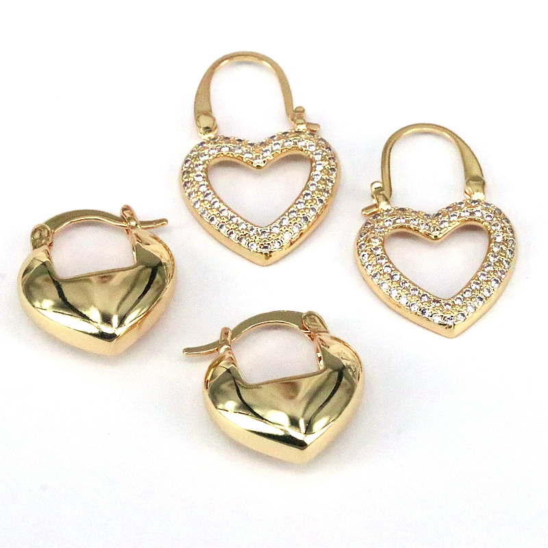1 par de pendientes chapados en oro con incrustaciones de cobre y circonita en forma de corazón
