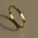 Brazalete de circonio chapado en oro de acero de titanio con ojo de estilo simple al por mayor