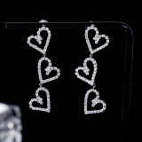 1 par de pendientes colgantes con diamantes de imitación de cobre con incrustaciones huecas en forma de corazón dulce