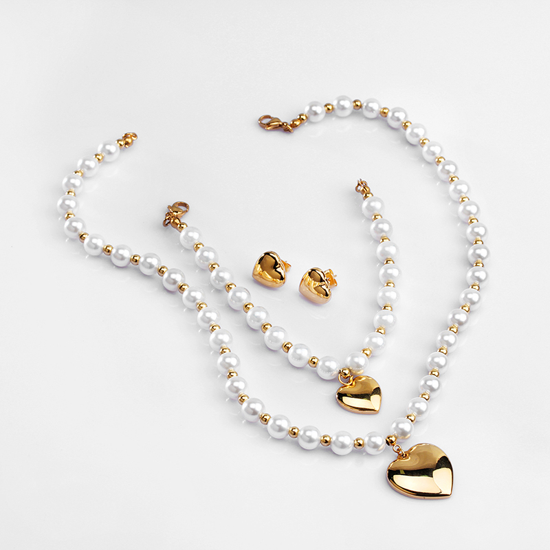 Elegante forma de corazón de acero inoxidable con cuentas de perlas artificiales, pulseras, pendientes, collar
