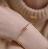 Pulseras plateadas oro del acero Titanium del nudo simple del estilo a granel