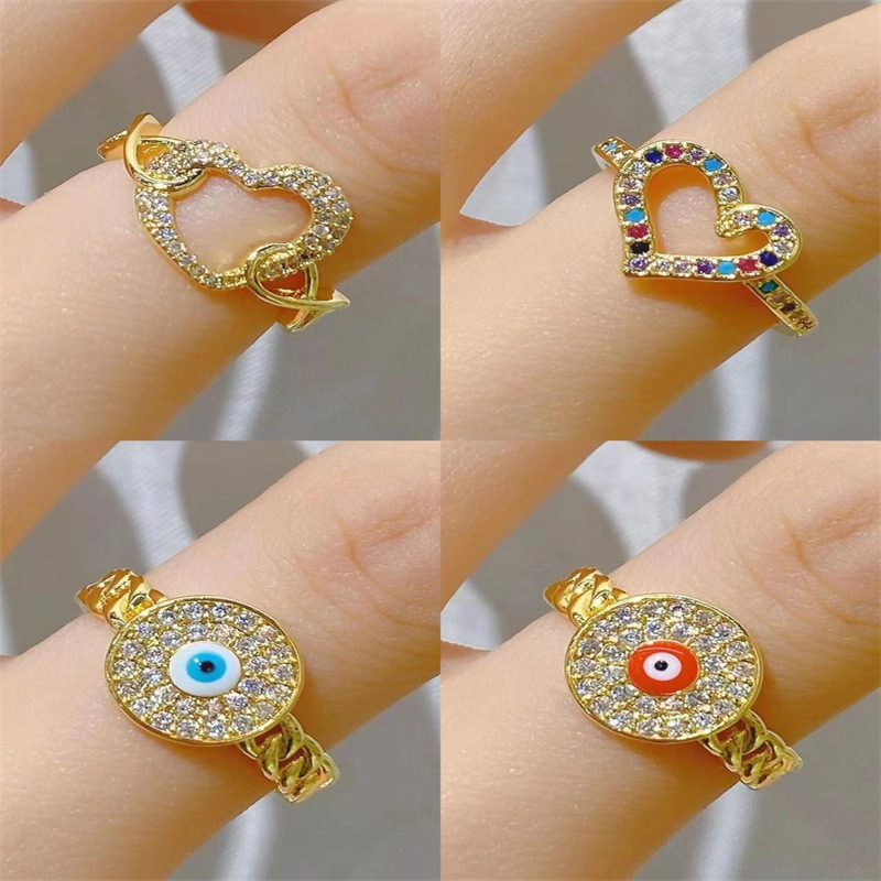 Anillo abierto de circón con incrustaciones de cobre y ojo en forma de corazón de estilo simple