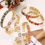 Brazalete chapado en oro de 14 quilates con incrustaciones de latón y mariposa Commute
