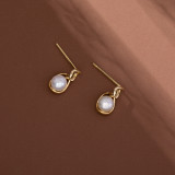 1 par de pendientes colgantes de perlas de cobre con incrustaciones redondas de estilo simple