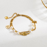 Pulseras chapadas en oro con perlas de imitación de acero inoxidable con forma de corazón de palma de ojo de diablo estilo INS al por mayor