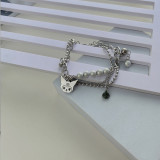 Versión coreana, pulsera de monstruo de doble capa, costura de perlas reflectantes, pulsera de acero de titanio, accesorios bonitos