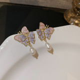 Pendientes de perlas artificiales de circón con incrustaciones de cobre con nudo de lazo de mariposa a la moda, 1 par