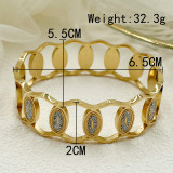 El chapado de acero inoxidable ovalado del estilo simple elegante ahueca hacia fuera el brazalete plateado oro del Zircon del embutido
