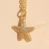 Collar con colgante chapado en oro de 14 quilates con incrustaciones de cobre y concha de estrella de mar de playa