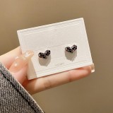 Pendientes de diamantes de imitación con incrustaciones de cobre con nudo de lazo en forma de corazón dulce 1 par