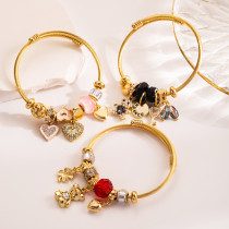 Brazalete chapado en oro de diamantes de imitación con incrustaciones de acero de titanio de aleación de oso dulce romántico lindo