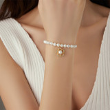 Venta al por mayor pulseras de perlas chapadas en oro con incrustaciones de acero inoxidable con flores de estilo clásico de estilo simple y lindo