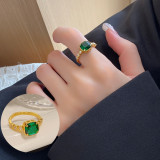 Anillo abierto con circonitas y baño de cobre geométrico Glam