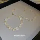 Pulseras plateadas oro dulce del Zircon del cobre de la flor del estilo simple a granel