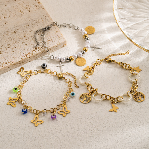Pulseras chapadas en oro en capas de perlas de imitación de acero inoxidable mariposa ojo del diablo cruz artística informal