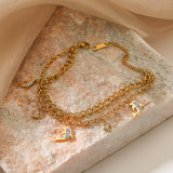 Pulseras chapadas en oro de 18 quilates con incrustaciones de acero de titanio y mariposa de delfín de hojas de viaje de estilo simple